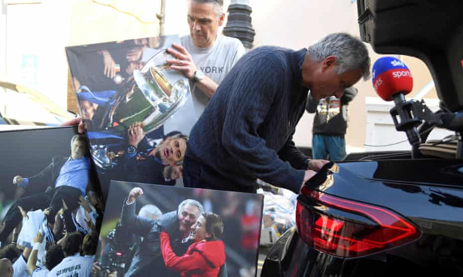 José Mourinho with photographs of his achievements in Football.