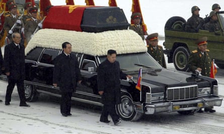Kim Jong-un walks beside the hearse containing his father, Kim Jong-il, in 2011. The transition of power led many to fear instability in the nuclear-armed country.