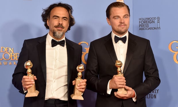 Alejandro González Iñárritu and Leonardo DiCaprio with awards at the 2016 Golden Globes.