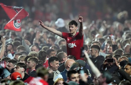 Jubilant Charlton Athletic fans invaded the pitch to celebrate their victory.