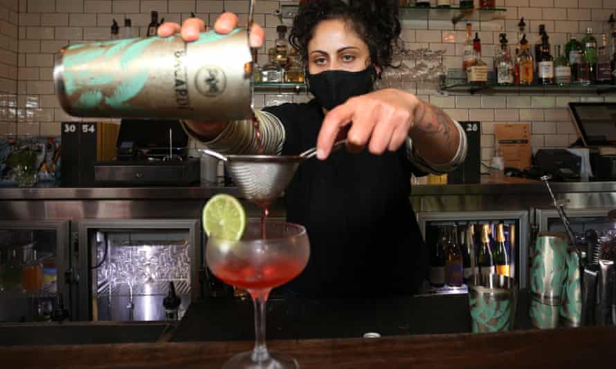 A bartender prepares a cocktail at Sydney’s Kings Cross Hotel as the city celebrates the lifting of a Covid lockdown