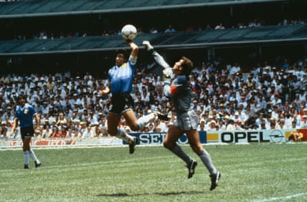 1986 Football World Cup, Mexico. Quarter Final, Argentina 2 v England 1. 22nd June, 1986. Argentina’s Diego Maradona scores 1st goal with his Hand of God, past England goalkeeper Peter Shilton