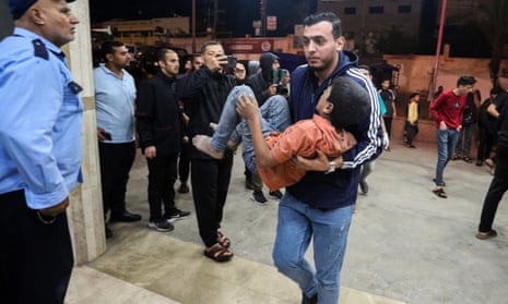 Injured Palestinians arrive at Nasser Medical Hospital on November 12 in Khan Yunis, Gaza.