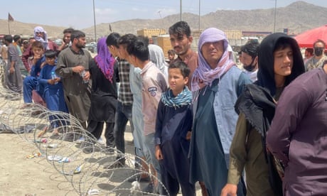 Afghans continue to wait at airport in Kabul<br>KABUL, AFGHANISTAN-AUGUST 20: Afghans continue to wait around the Kabul International Airport as they try to flee the Afghan capital of Kabul, Afghanistan on August 20, 2021. (Photo by Haroon Sabawoon/Anadolu Agency via Getty Images)