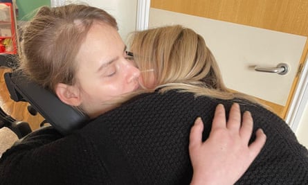 Angel Lynn, hugging her mother, Nikki, was left with brain injuries after the attack.