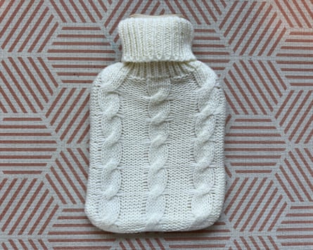 Argos hot-water bottle with chunky knit cover.