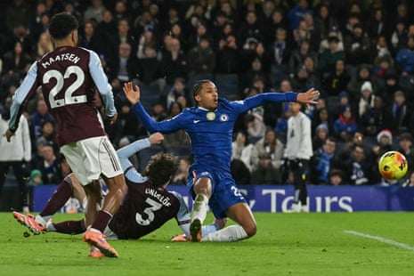 Chelsea’s João Pedro (right) hits the deck after tussling with Aston Villa’s Victor Lindelöf