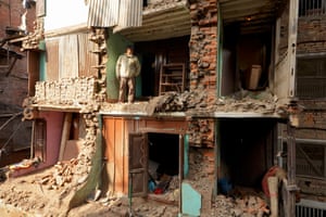 A homeowner oversees rebuilding of his house in Kathmandu, Nepal