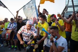 Fans in Tadej Pogacar’s hometown of Komenda, Slovenia celebrate his win and cheer fellow countryman Primoz Roglic as they gather to wathc ht final stage and award ceremony on television.
