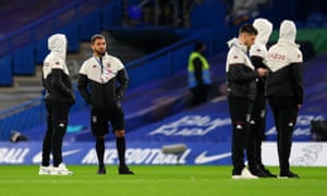 Douglas Luiz of Aston Villa with some people in hoods