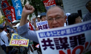 Protesters shout slogans as they protest against an anti-conspiracy bill outside parliament building in Tokyo.