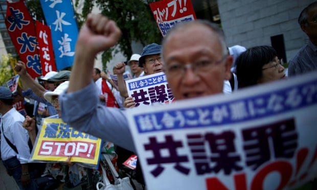 Protesters shout slogans as they protest against an anti-conspiracy bill outside parliament building in Tokyo.