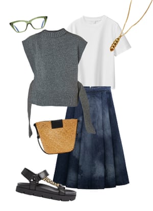 A grey knitted tank top layered over a white t-shirt and denim skirt