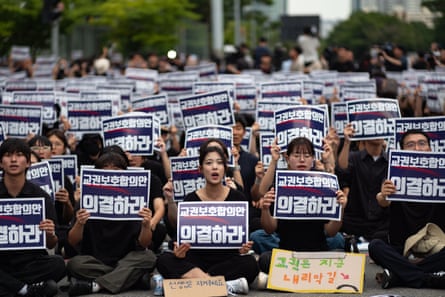Tens of thousands of teachers shout slogans during rally in front of the National Assembly in Seoul on Monday.