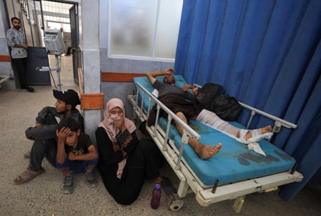 A Palestinian wounded by Israeli fire while seeking aid in northern Gaza, according to Gaza's health ministry, lies at Al-Shifa hospital, in Gaza City on Wednesday.