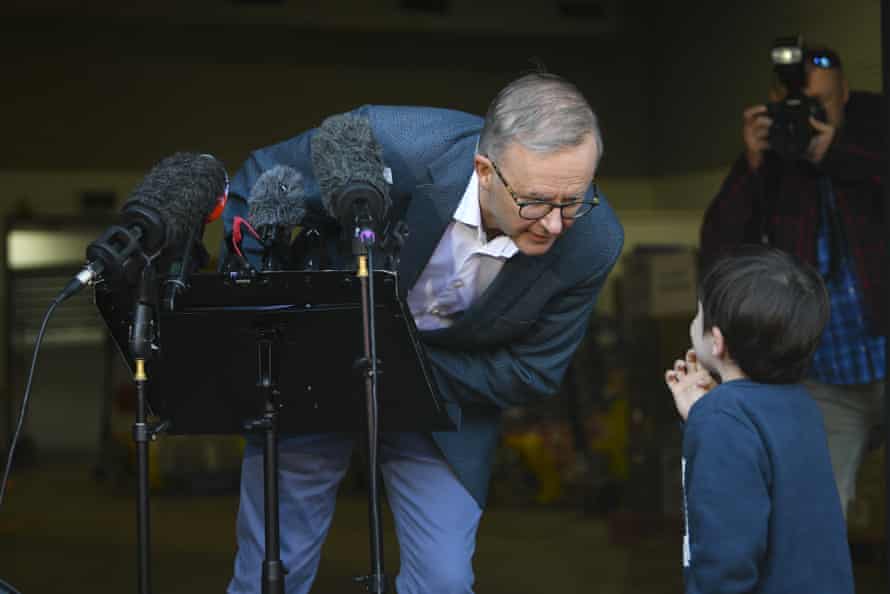 Labor leader Anthony Albanese speaks to a child who interrupted a press conference in Sydney.