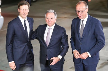 Kushner and Witkoff, who has his hand on Kushner's back, stand alongside Merz