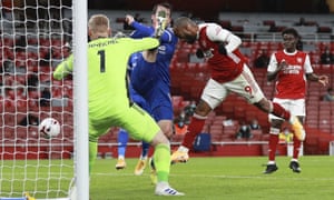Arsenal’s Alexandre Lacazette (right) heads wide.
