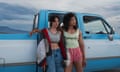 Kristen Stewart and Katy O’Brian leaning against a pick-up.