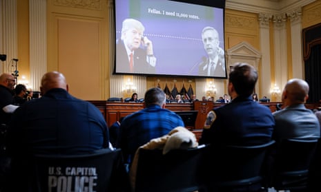 people watch screen at hearing. screen shows trump on phone saying 'fellas, i need 11,000 votes'
