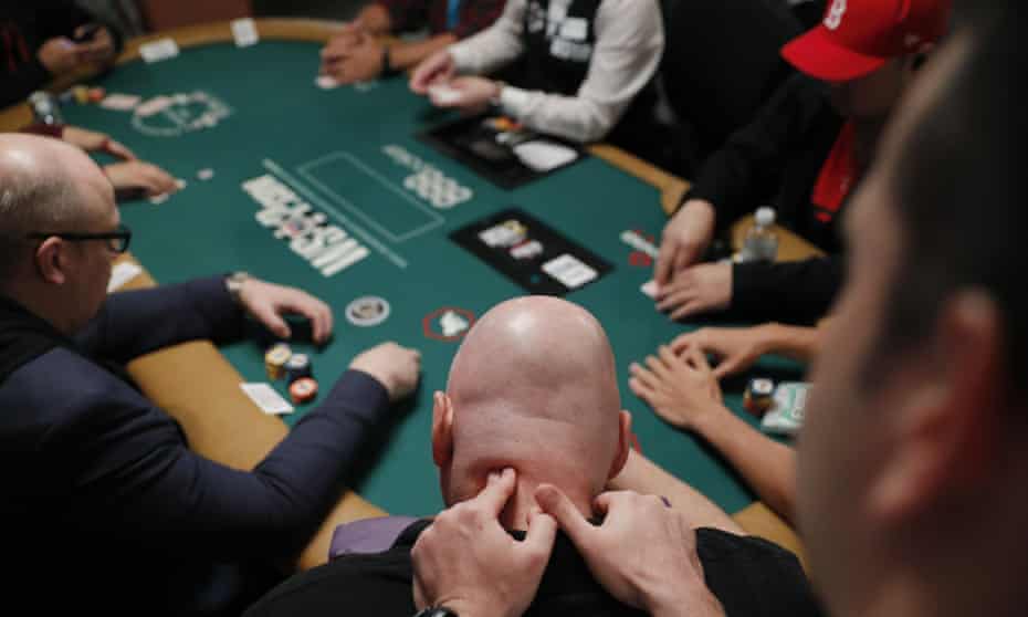 Stressful hand … a player gets a message during the first day of the World Series of Poker in Las Vegas last week.