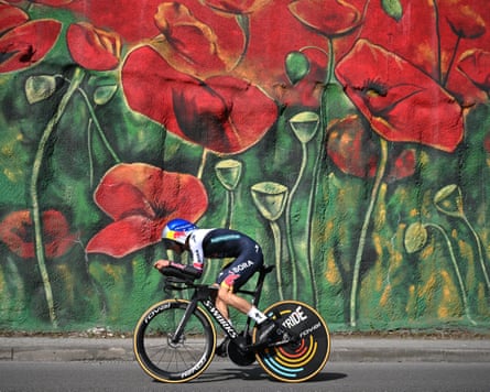 Primoz Roglic passes a mural in Tirana but the Sloven had to settle for second place and the leader’s maglia rosa.