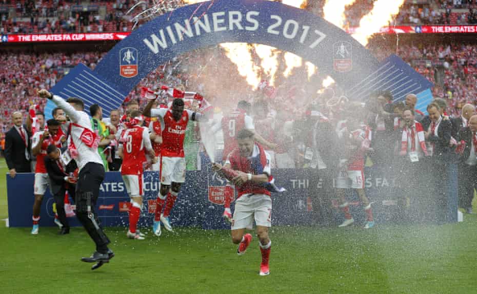 Alexis Sanchez leads the champagne celebrations.