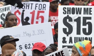 Protesters demand higher wages at an earlier rally.