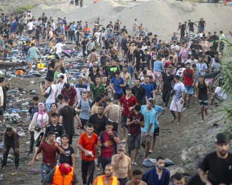 Hundreds of migrants have attempted to swim from Morocco to the Spanish city of Ceuta in north Africa.