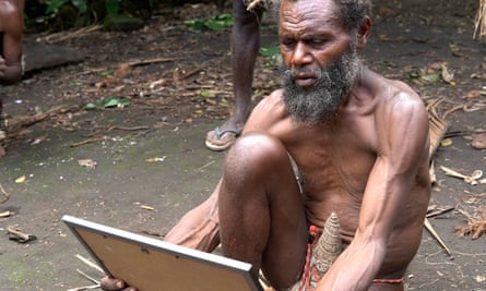 Chief Albi of Yakel village on Tanna stares at a portrait of Prince Philip
