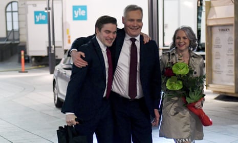 Antti Rinne, centre, leaves an election party with his wife, Heta Ravolainen-Rinne, and an assistant.