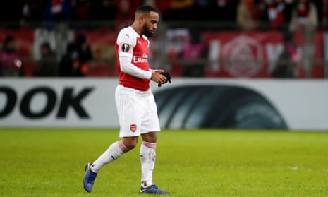 Alexandre Lacazette leaves the field after being sent off.