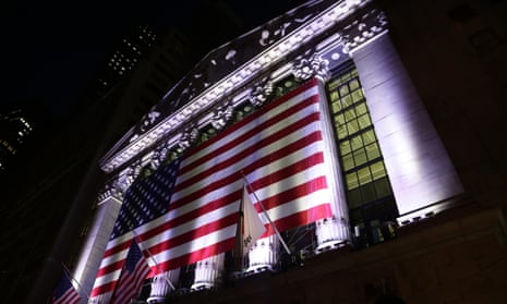 An American flag hangs on the front of the New York Stock Exchange. 