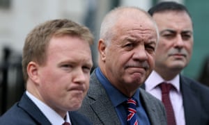 Victims’ campaigner Raymond McCord (C) and solicitors Ciaran O’Hare (L) and Paul Farrell outside court after the judge dismissed their case.