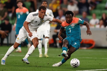 Nestory Irankunda of Australia shoots against Curacao