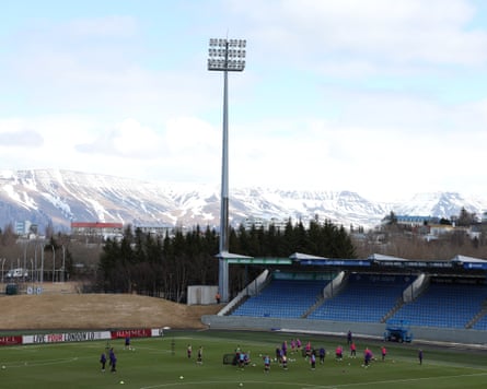 England players train in Reykjavik with mountains in the distance.