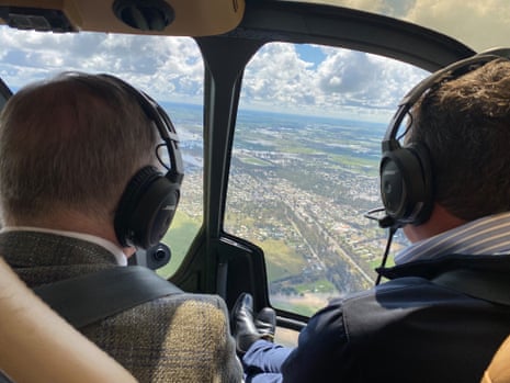 Daniel Andrews and Anthony Albanese sit in a helicopter overlooking flood-affected areas of Victoria over the weekend.
