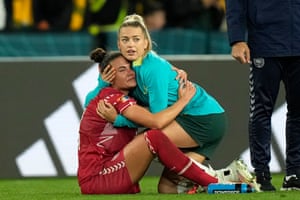 Denmark’s Katrine Veje is comforted by Australia’s Charlotte Grant.