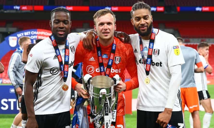 (Left to right) Josh Onomah, goalkeeper Marek Rodak and Michael Hector celebrate at Wembley on Tuesday after clinching promotion to the Premier League.
