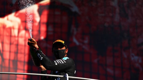 Hamilton celebrates on the podium.
