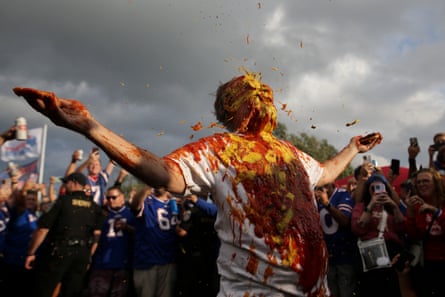 Ken Johnson, known as ‘Pinto Ron’ for his 1980 Ford Pinto, is doused with ketchup and mustard as part of a Buffalo Bills tailgate tradition before last month’s game against the Tennessee Titans.