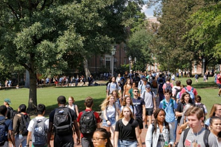 Students walk through the campus of the University of North Carolina at Chapel Hill in 2018.