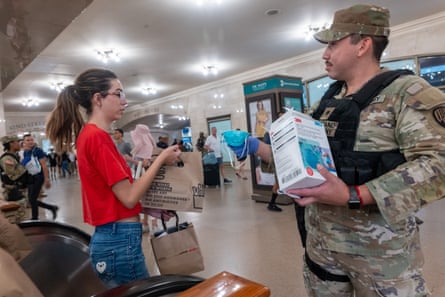 National Guard soldiers hand out face masks to commuters at Grand Central Terminal as haze from Canadian wildfires blankets Manhattan in New York City.