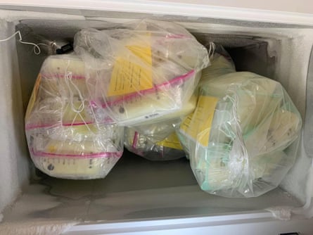 Breast milk packaged in plastic bags are stuffed inside a freezer