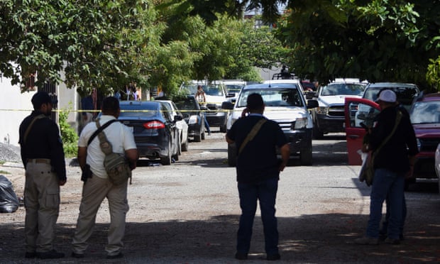 Police officers guard the area where Antonio de la Cruz was killed in Ciudad Victoria.