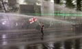 Police use water cannons to disperse protesters near the Georgian parliament in Tbilisi.