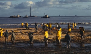 Workmen clean up after an oil spill in Santa Barbara, California in 1969.