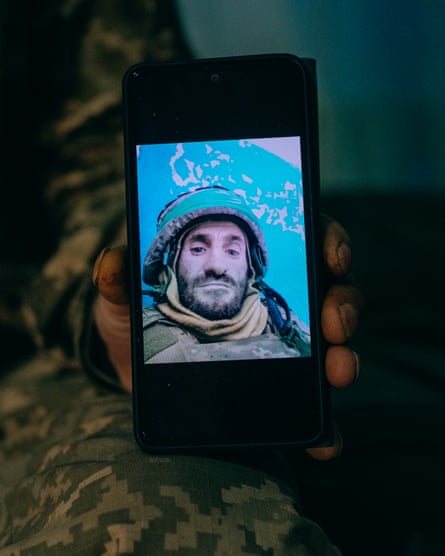 Selfie of Ivan on phone screen in military helmet and with a beard (in the current photos he is clean shaven)