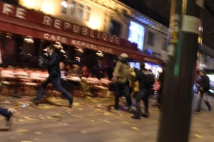 People run after hearing what are believed to be explosions or gun shots near Place de la République