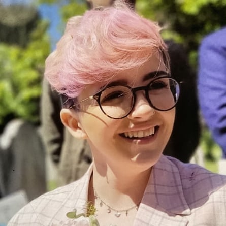 A smiling Immy Nunn with pink hair.